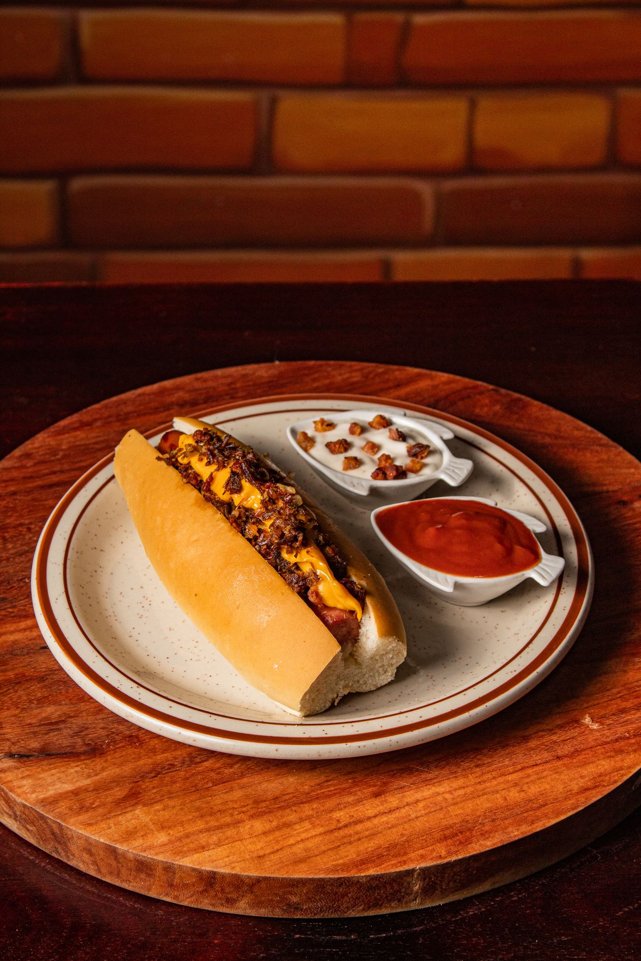 Detroit-style coney dog piled with chili, mustard, and onions