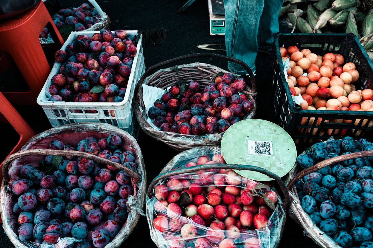 Colorful array of fresh fruit at an outdoor market stall